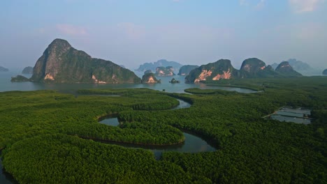 Orbit-drone-shot-of-Samet-Nangshe,-One-of-most-famous-place-in-south-of-Thailand-with-mangrove-forest-and-limestone-mountains-in-Andaman-sea