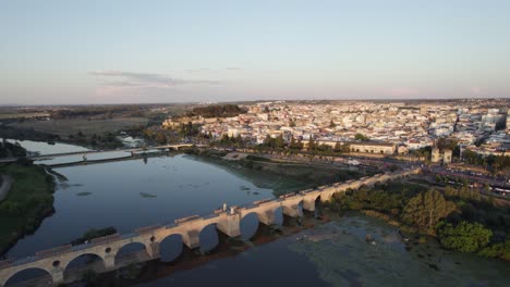 aerial pullback from puente de palmas over guadiana river, badajoz