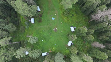 4k aerial drone footage of thandiani’s lush green meadows and cloudy peaks