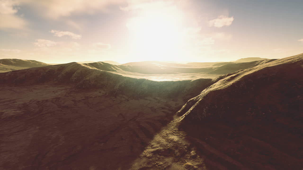 Sunset over rolling hills in a vast desert landscape offers tranquil beauty