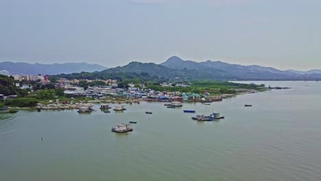 a dynamic onward aerial footage of the fishing village in lau fau shan in the new territories of hong kong