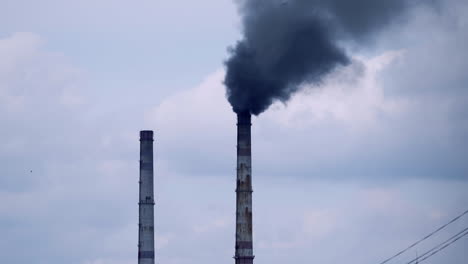 factory pipes with smoke. smoke of pipes pollutes atmosphere