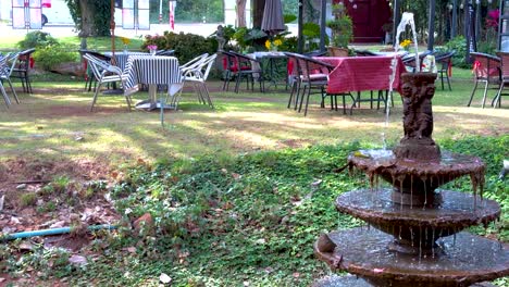 outdoor seating area with a central fountain