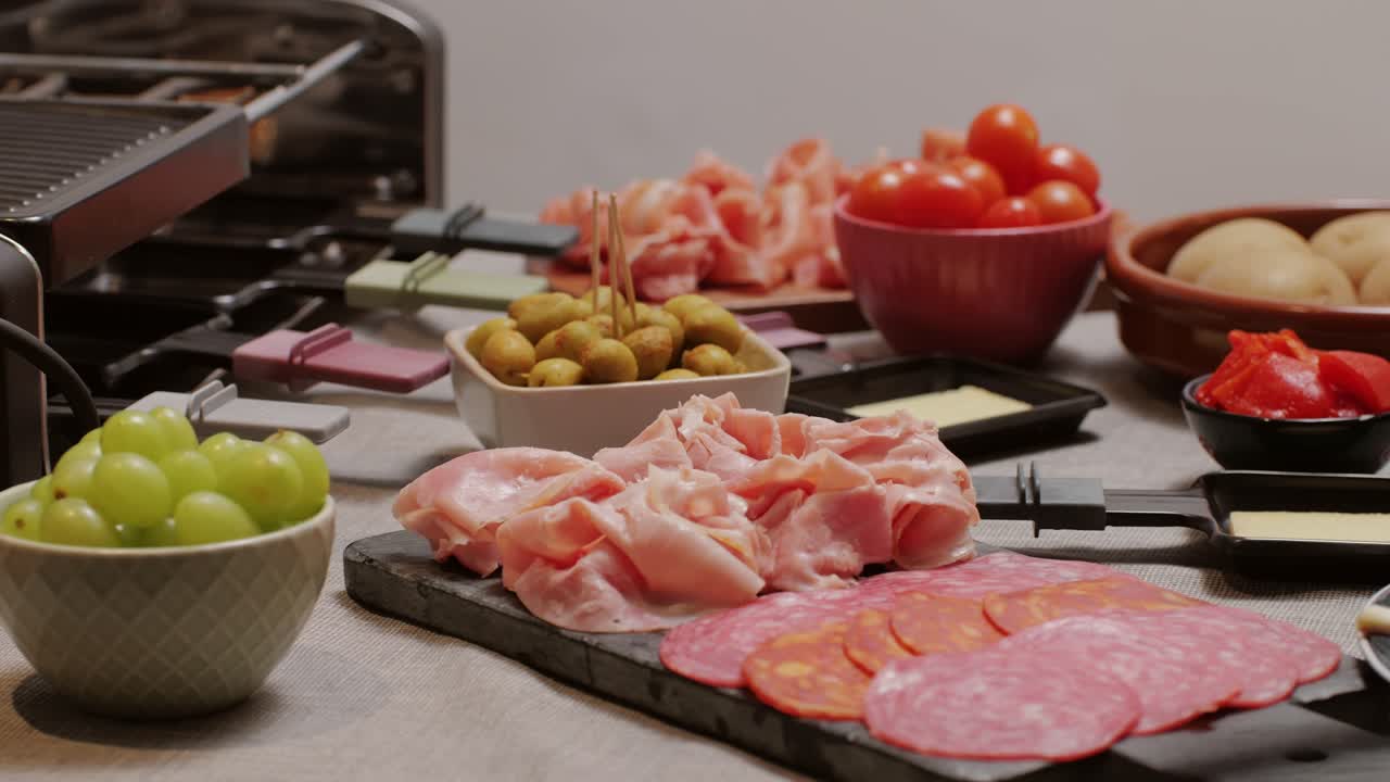 Italian or Spanish restaurant with traditional tapas food, Spanish cuisine, delicious tapas and cheese plate, bruschetta with cheese, olives dry tomatoes and tasty sandwich bar appetizer, buffet