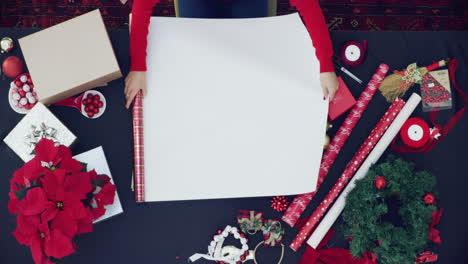 woman wrapping christmas gifts