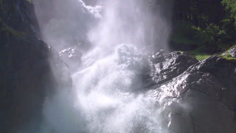 aerial rising zoom out reveal, huge plumes of spray rise upwards