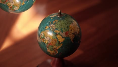 vintage world unveiled: spinning mapa mundi, political charm in stock video