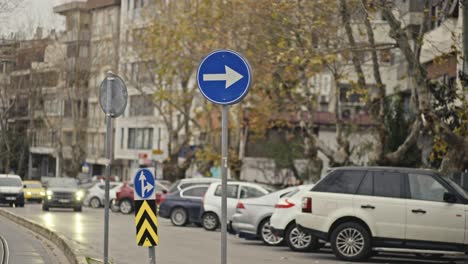 highway traffic, parking, sidewalk, sign, trees