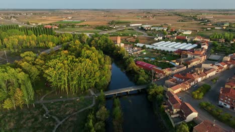 drone reveal of village township in spain at sunset