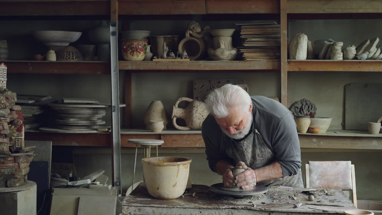 Senior Potter Working in a Studio