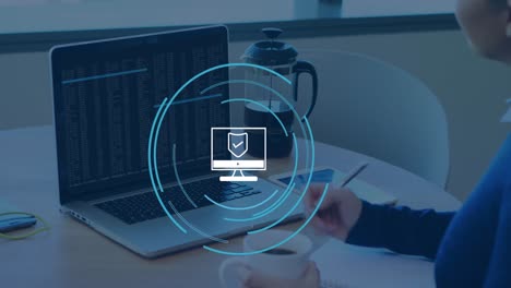 Animación-Del-Icono-De-La-Computadora-Sobre-Una-Mujer-De-Negocios-Caucásica-Usando-Una-Computadora-Portátil-En-La-Oficina