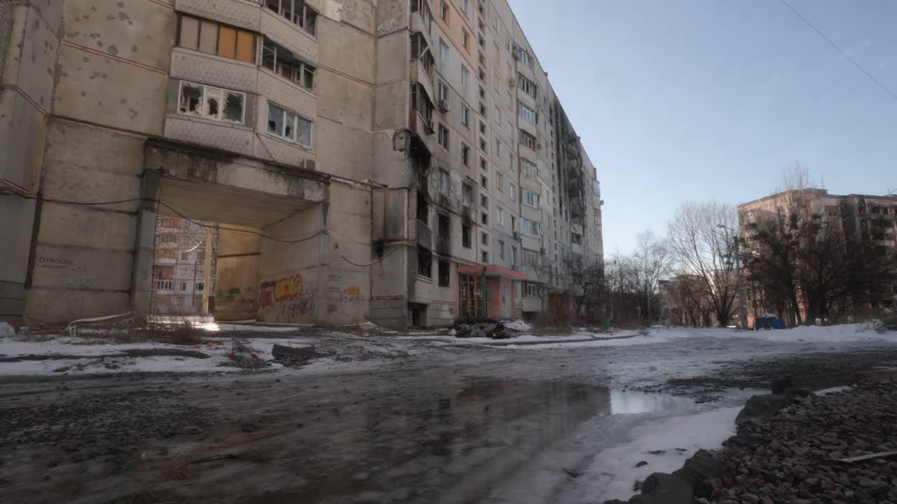 War-Damaged High-Rise Building and Icy Street in Ukraine After Russian Shelling