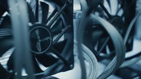 focus on intricate details of computer hardware components in a tech environment. the scene highlights fans and cooling systems that keep computers running efficiently, showcasing modern technology.