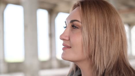 a beautiful woman singing about ukraine in the middle of the ruins of bombed buildings