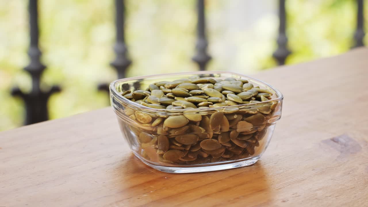 Pumpkin Seeds in a Glass Bowl