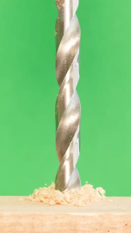 drill bit drilling into wood