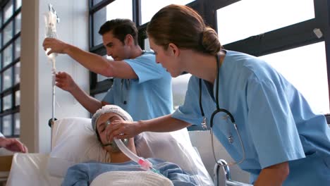 medical team carrying a patient to intensive care unit