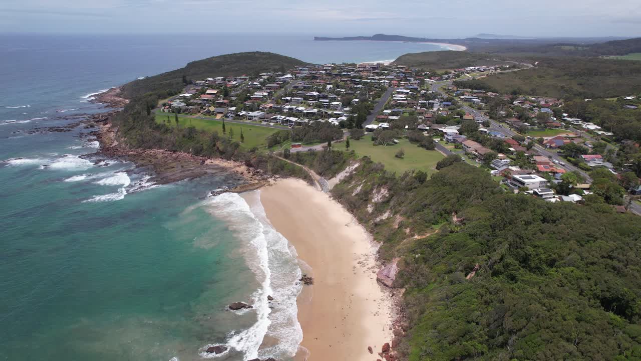 Aerial View Of Bartletts Beach And Reserve On Tasman Sea Coast In Bonny Hills, NSW, Australia. pullback shot