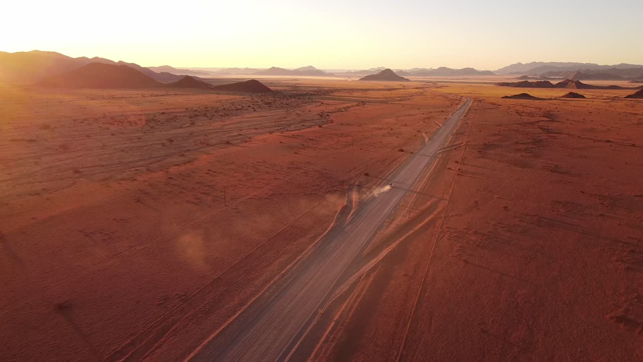 Namibian self-drive wildlife adventure with a rooftop-tent equipped Toyota Hilux in Sossusvlei's iconic sand dunes at sunset