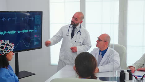 Nurse-wearing-headset-with-sensors-during-neuoroscience-experiment