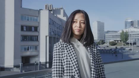 portrait of a young adult asian woman in the city downtown