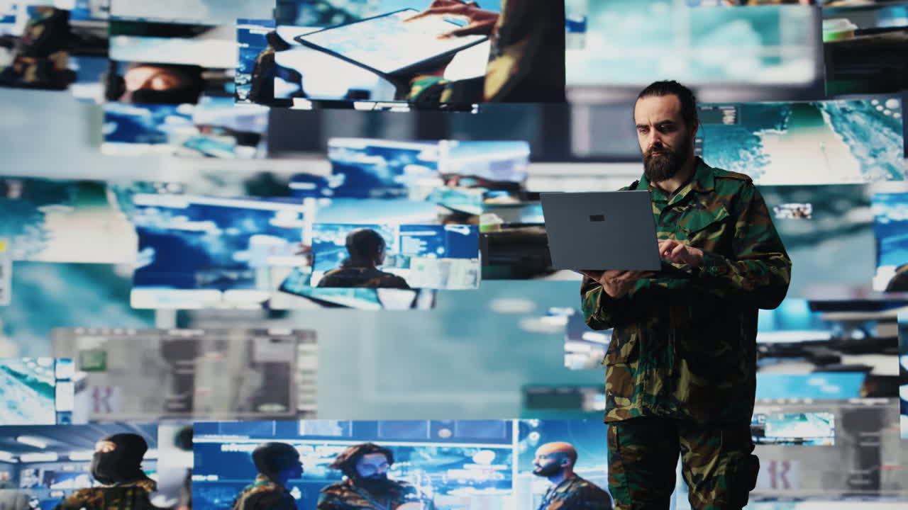 Officer monitoring real time combat data using advanced military systems