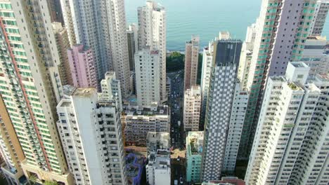 Mega-residential-buildings-and-traffic-in-downtown-Hong-Kong,-Aerial-view