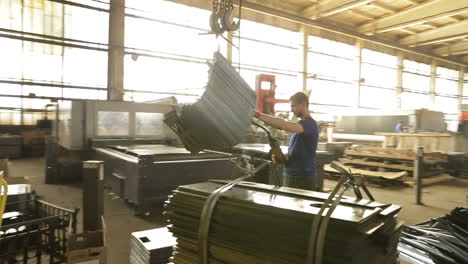bar, ukraine - august 2017: view of male worker works in a factory