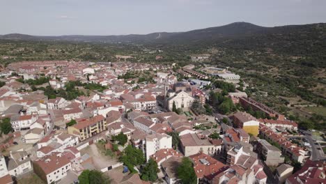 aerial view circling across the parish of san marti n de valdeiglesias idyllic spanish town streets and scenic neighbourhood