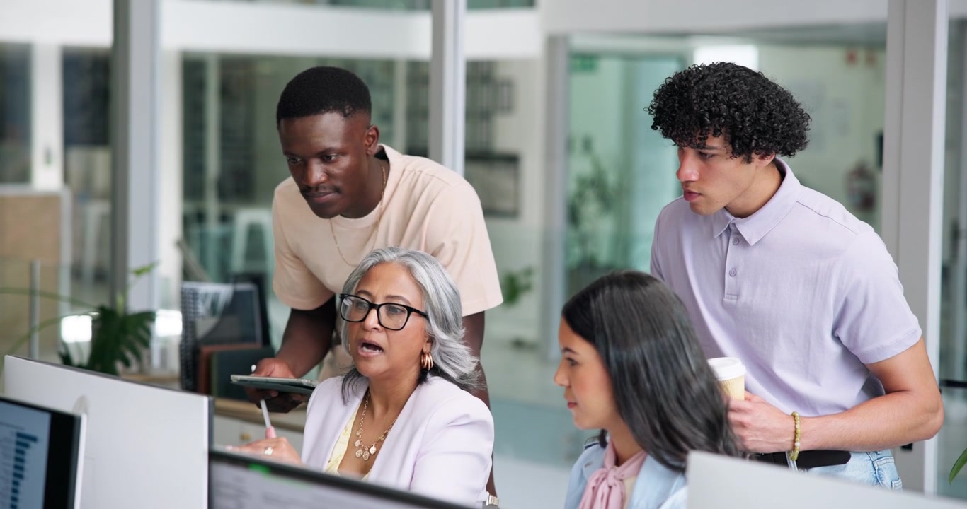Diverse Team Collaborating on Project in Modern Office