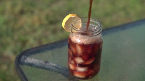 pouring sweet tea on a sunny day