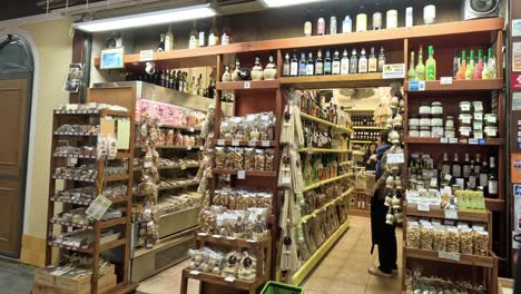 person browsing through aisles in a well-stocked store