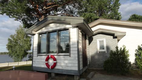 small waterfront house with security booth