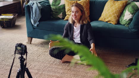 Woman giving a video presentation at home
