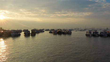 boats on mumbai water at dawn. colaba region of mumbai, maharashtra, india.