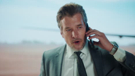 man in suit at airport
