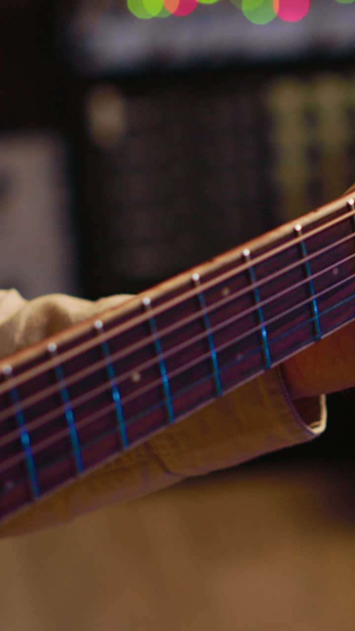 Man Playing Acoustic Guitar in a Music Studio
