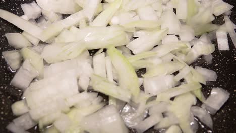 chopped onions frying in a pan