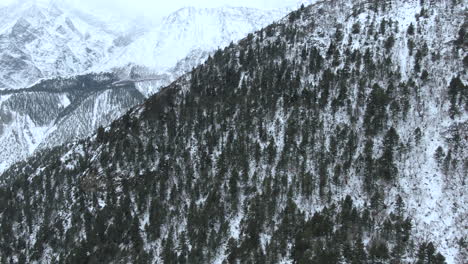 drone shot of annapurna mountain revealed on snowy day in manang, nepal