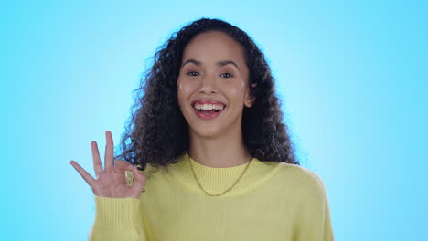 okay sign, happy and face of woman in studio