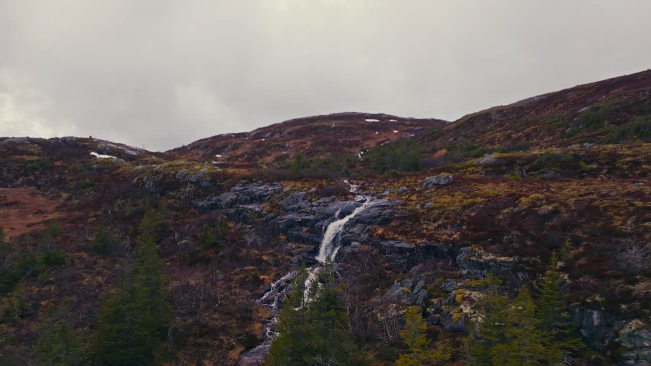 Flying To A Rocky Waterfall On The Mountains Near Reinsjoen Lake In Norway. Aerial Drone Shot