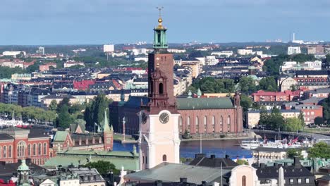 beautiful aerial of stockholm city hall and storkyrkan church over old town