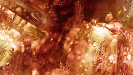 closeup of ice cubes in a soda drink