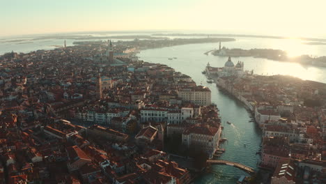 Dolly-back-establishing-drone-shot-over-Central-Venice-city-at-sunrise