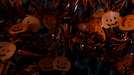 Halloween-pumpkins-hanging-decoration-string-movement-in-dark-background