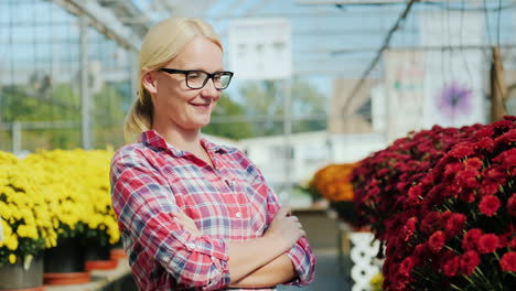 happy woman in plant nursery