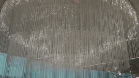 elegant ceiling chandelier with glowing strands of light