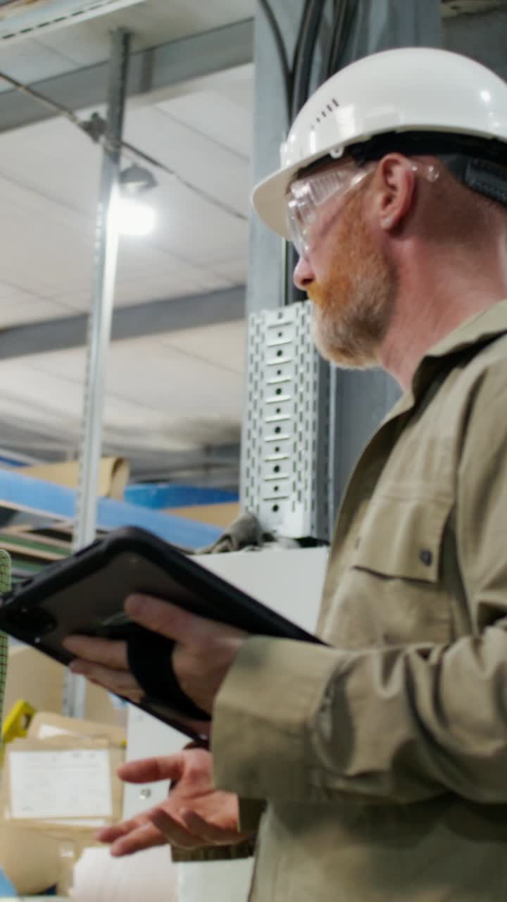 Businesswoman and Technician Discuss Factory Work