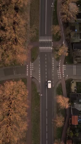 aerial view of a european town intersection with cars and pedestrians