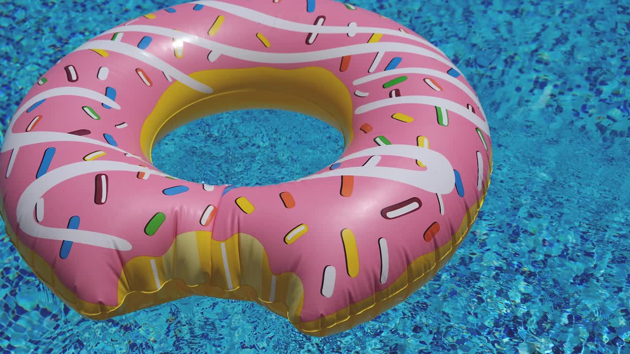 pink inflatable donut floating in swimming pool 4K